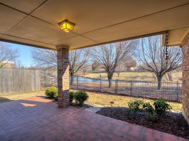 view of patio with a water view