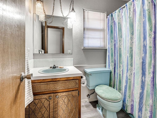 bathroom with vanity, wood-type flooring, and toilet