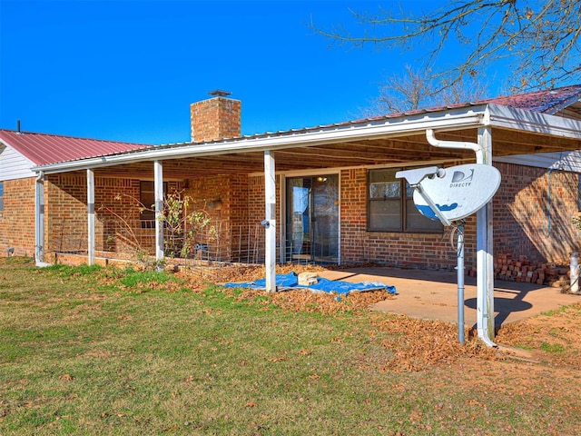 back of house with a yard