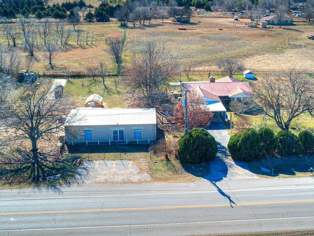 birds eye view of property featuring a rural view