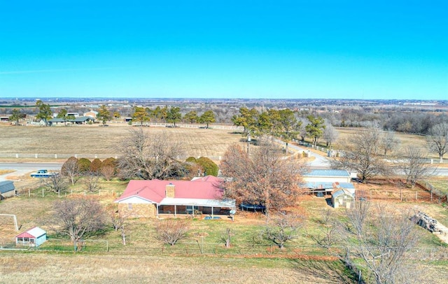 birds eye view of property with a rural view