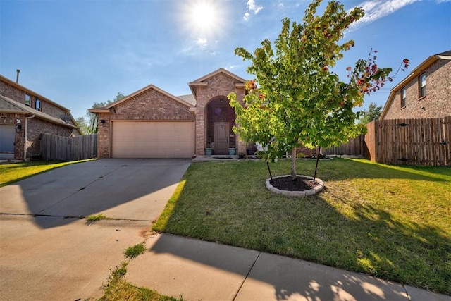 view of front of house with a garage and a front yard