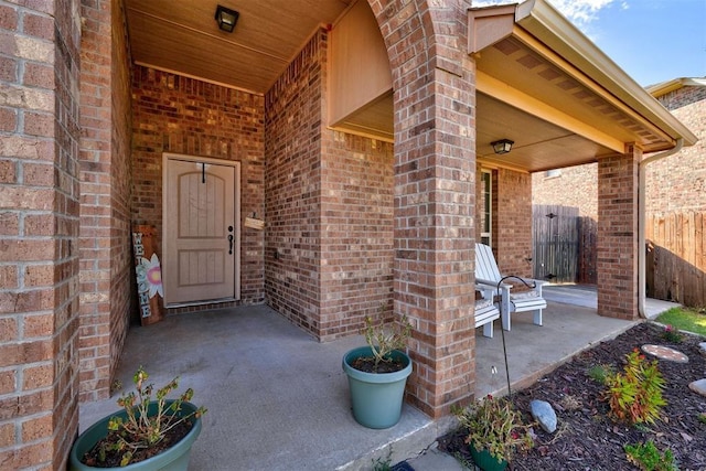 property entrance featuring a patio area