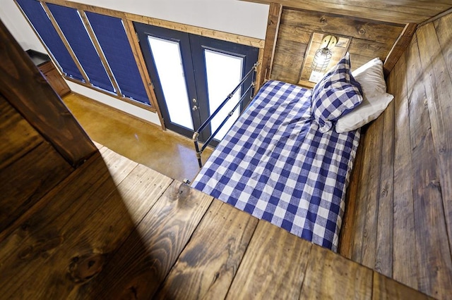 unfurnished bedroom featuring wooden walls