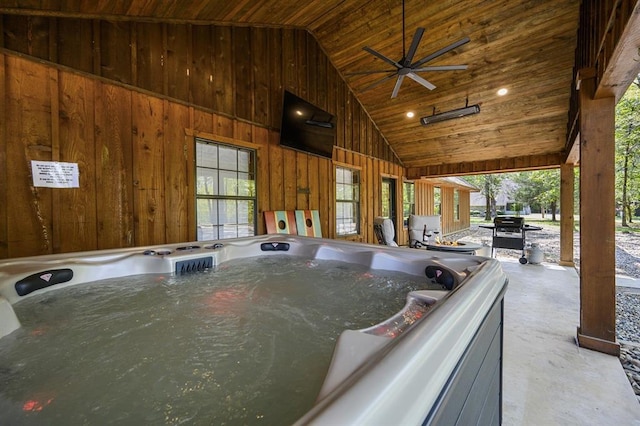 view of swimming pool featuring a hot tub