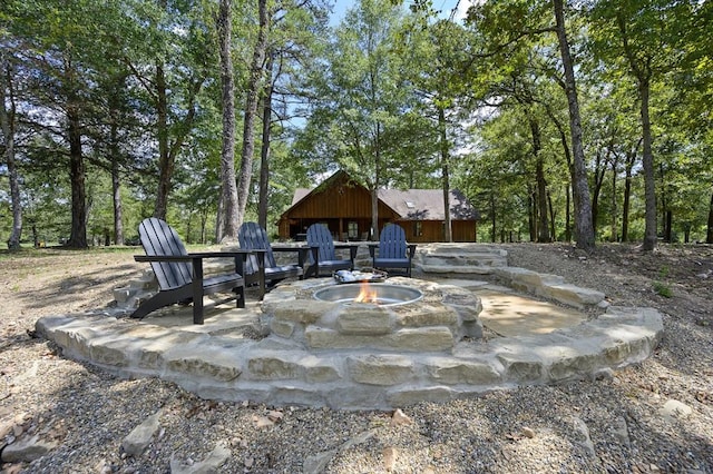 view of patio with a fire pit