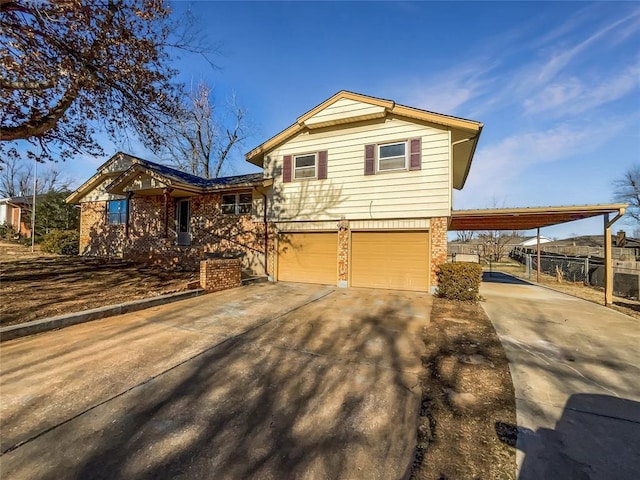 tri-level home featuring a carport and a garage