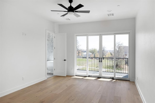 unfurnished room featuring light hardwood / wood-style floors and ceiling fan