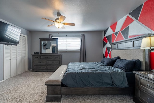 bedroom with carpet floors, a closet, and ceiling fan