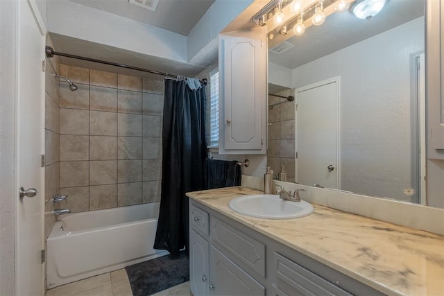 bathroom with tile patterned flooring, vanity, and shower / bath combination with curtain