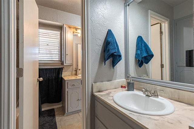 bathroom with vanity and tile patterned floors