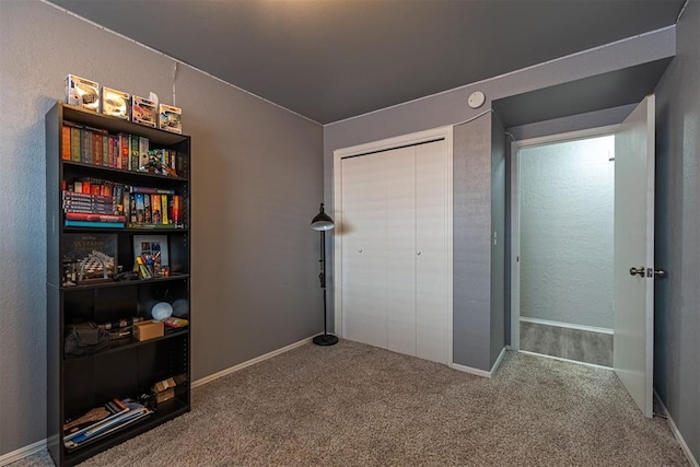 carpeted bedroom featuring a closet