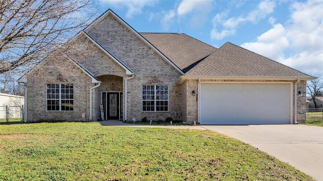 view of front of home featuring a garage and a front lawn