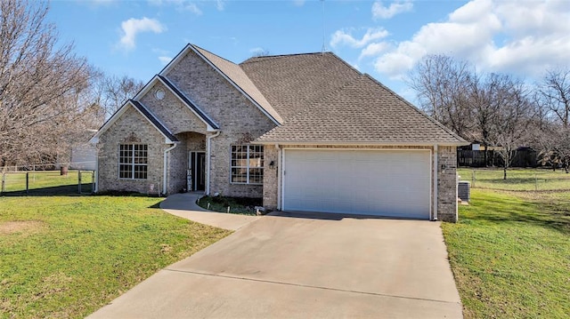 view of front of house with a garage and a front yard