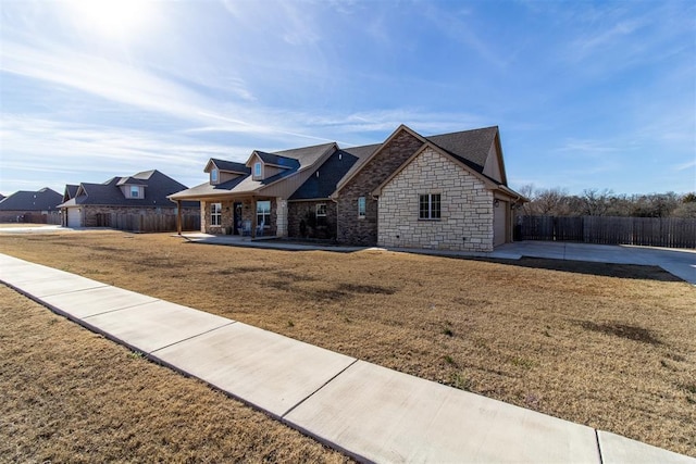 view of front of home with a patio area and a front lawn