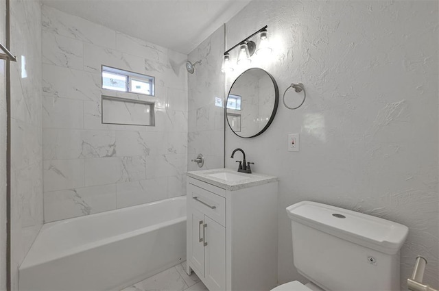 full bathroom with vanity, toilet, and tiled shower / bath