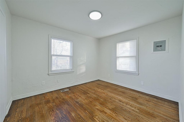 empty room featuring hardwood / wood-style flooring