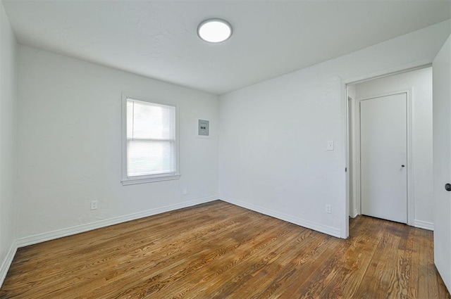 unfurnished room featuring dark hardwood / wood-style floors