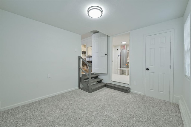 unfurnished bedroom with carpet flooring and a closet