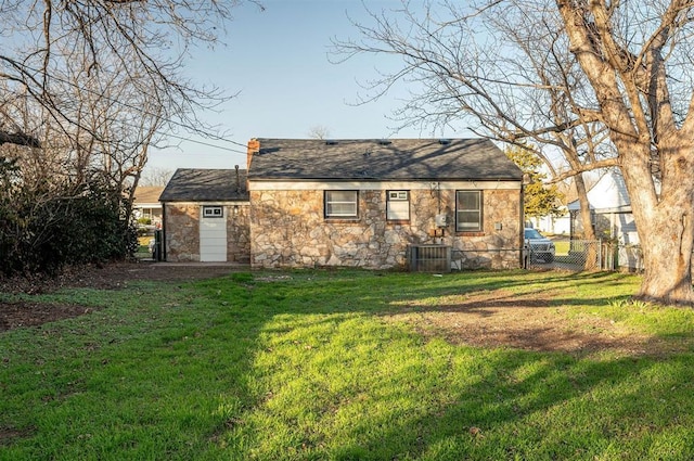 back of house with a yard