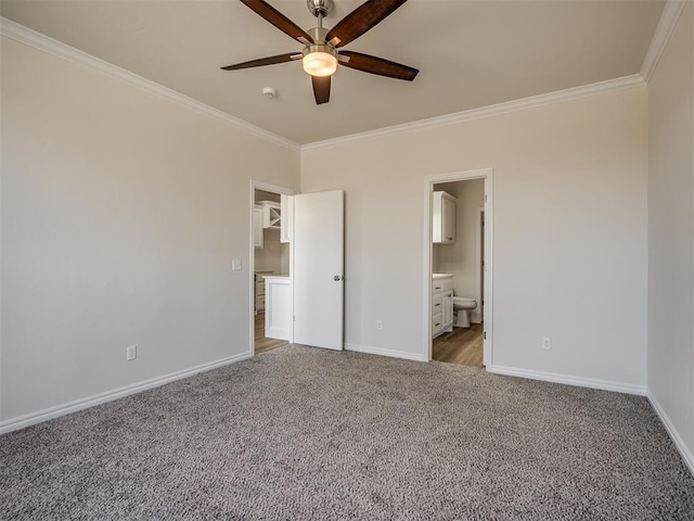 unfurnished bedroom with connected bathroom, carpet floors, ceiling fan, and crown molding