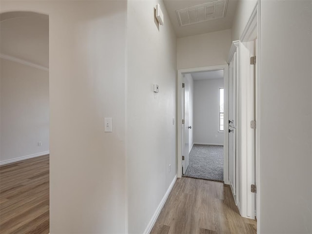 hall with light hardwood / wood-style flooring