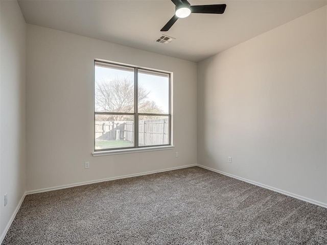 empty room with carpet flooring and ceiling fan