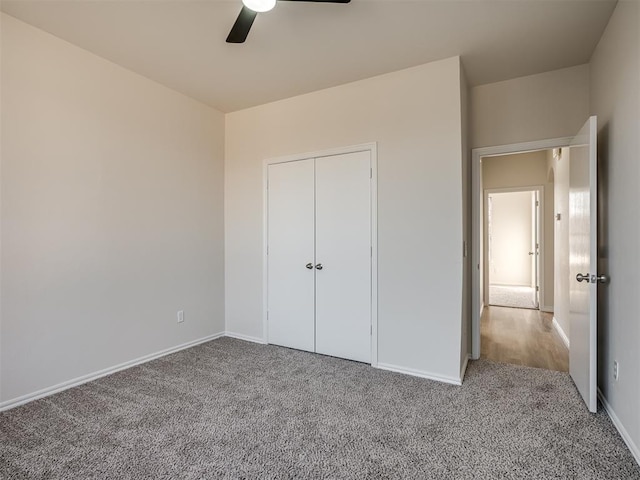 unfurnished bedroom with carpet flooring, a closet, and ceiling fan