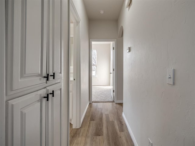 corridor featuring light hardwood / wood-style floors
