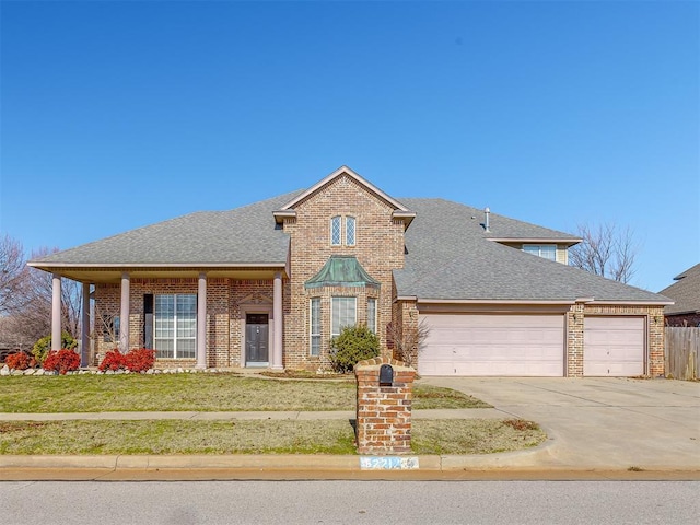 view of front facade featuring a garage and a front lawn