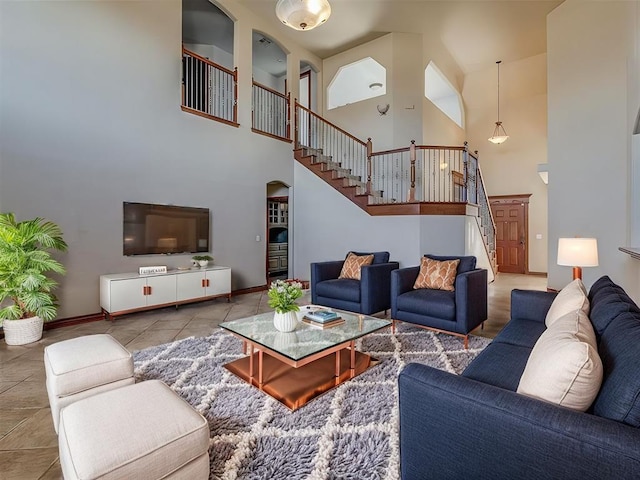 tiled living room featuring a high ceiling