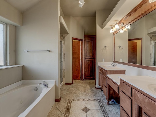 bathroom with tile patterned floors, vanity, and independent shower and bath