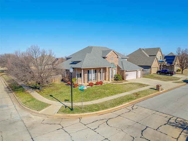 view of front of house with a garage and a front yard