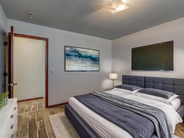 bedroom with light hardwood / wood-style flooring