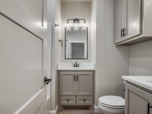 bathroom featuring vanity and toilet