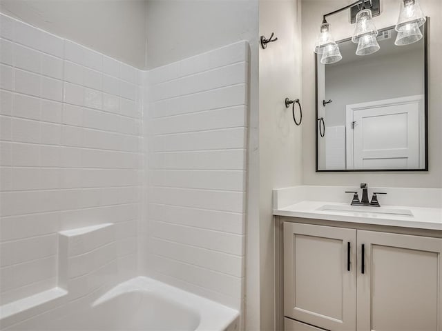 bathroom featuring bathing tub / shower combination and vanity