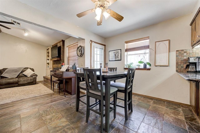 dining area with ceiling fan