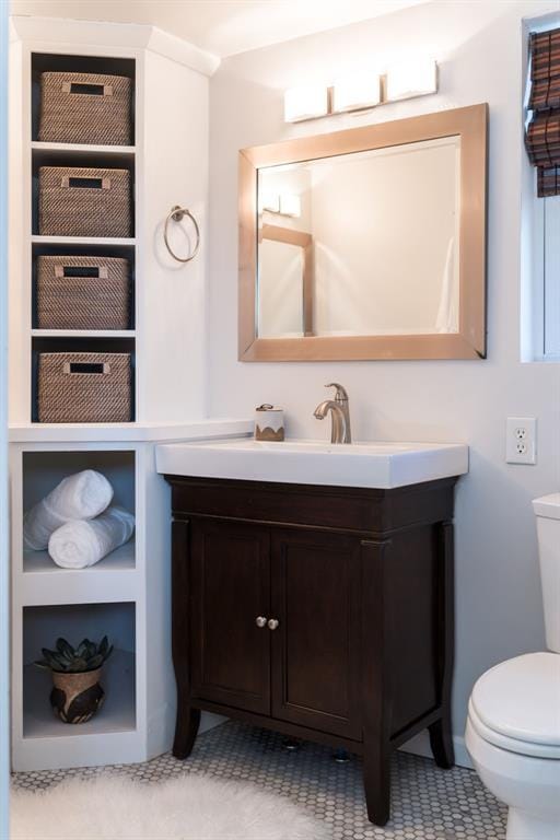 bathroom with vanity and toilet