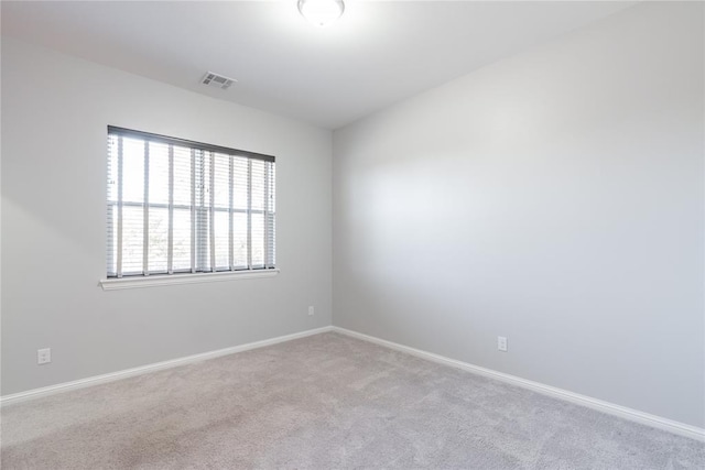 empty room with light colored carpet