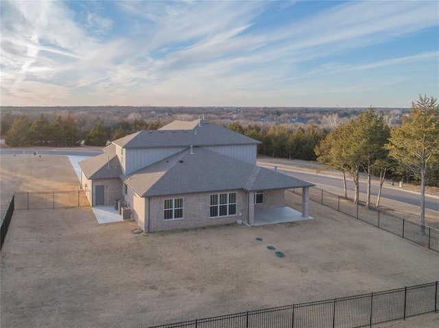 back of property featuring a patio