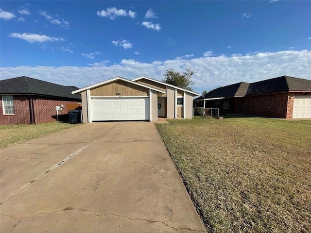 ranch-style house featuring a front yard and a garage