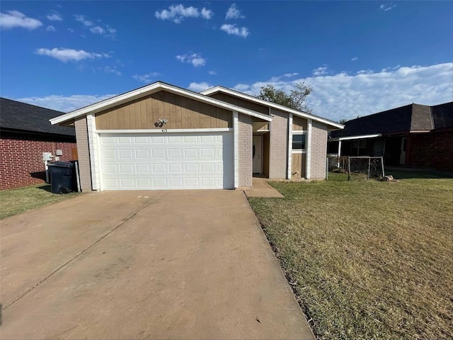 single story home featuring a garage and a front yard