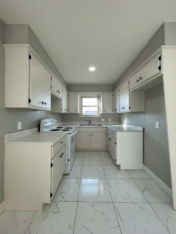 kitchen featuring sink, white cabinetry, and white electric stove