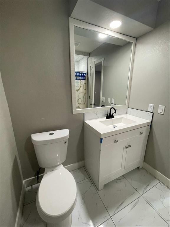 bathroom with vanity and toilet