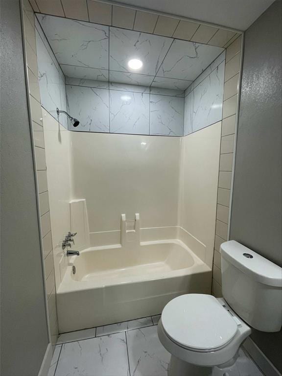 bathroom with toilet and tub / shower combination