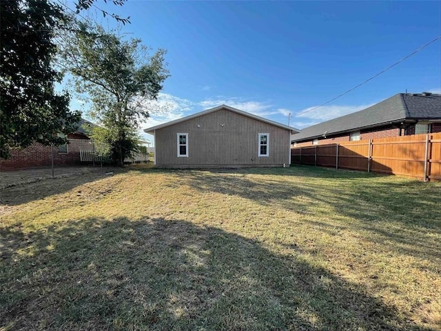 rear view of house with a yard