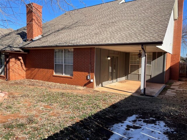 back of property with a patio area