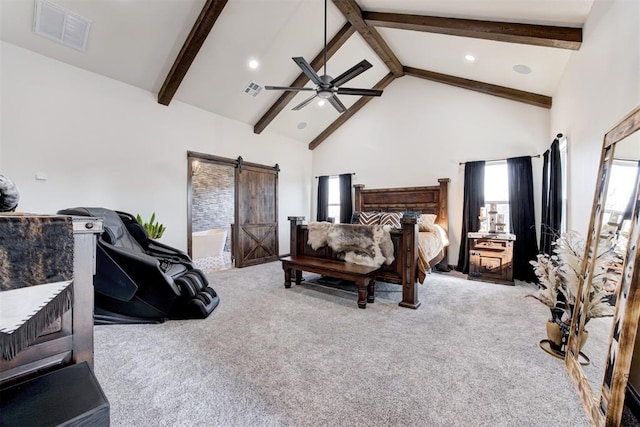 carpeted bedroom with a barn door, beam ceiling, and high vaulted ceiling