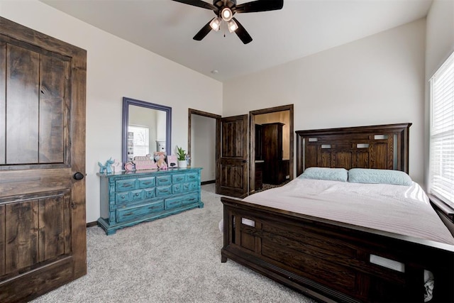 bedroom featuring light colored carpet and ceiling fan