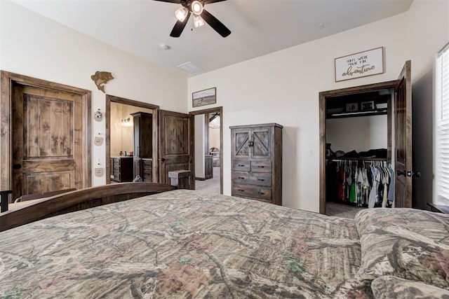 bedroom with ceiling fan, a closet, and a spacious closet